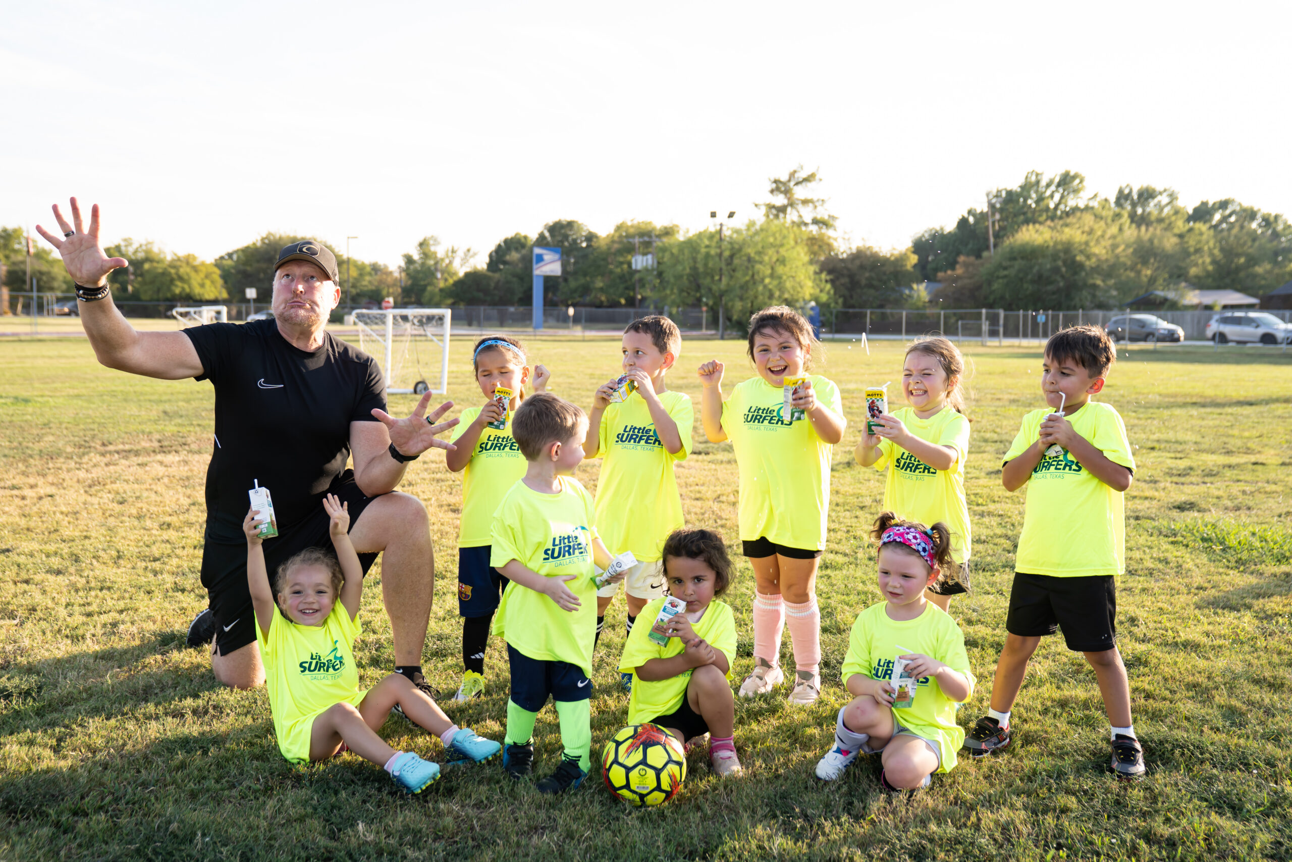 Little Surfers children enjoying a moment with their coach